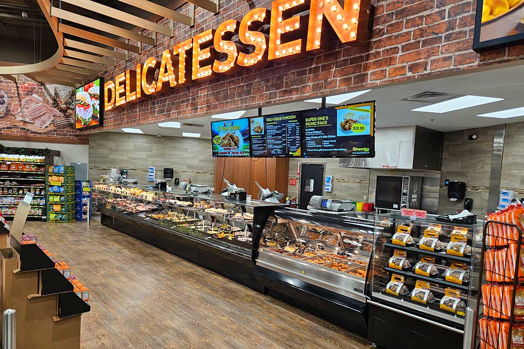 Bakery department with a variety of freshly baked goods on display at Super One Foods.