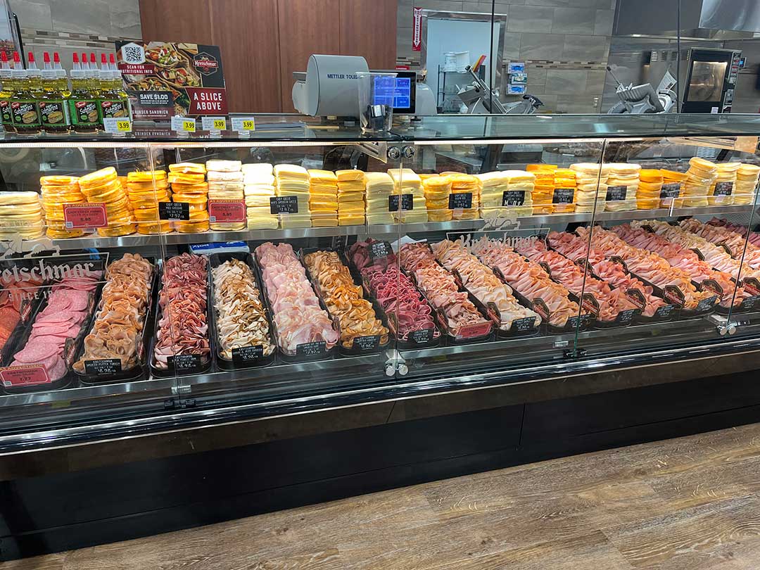 Fresh cut deli meats displayed in the deli section at Super One Foods.